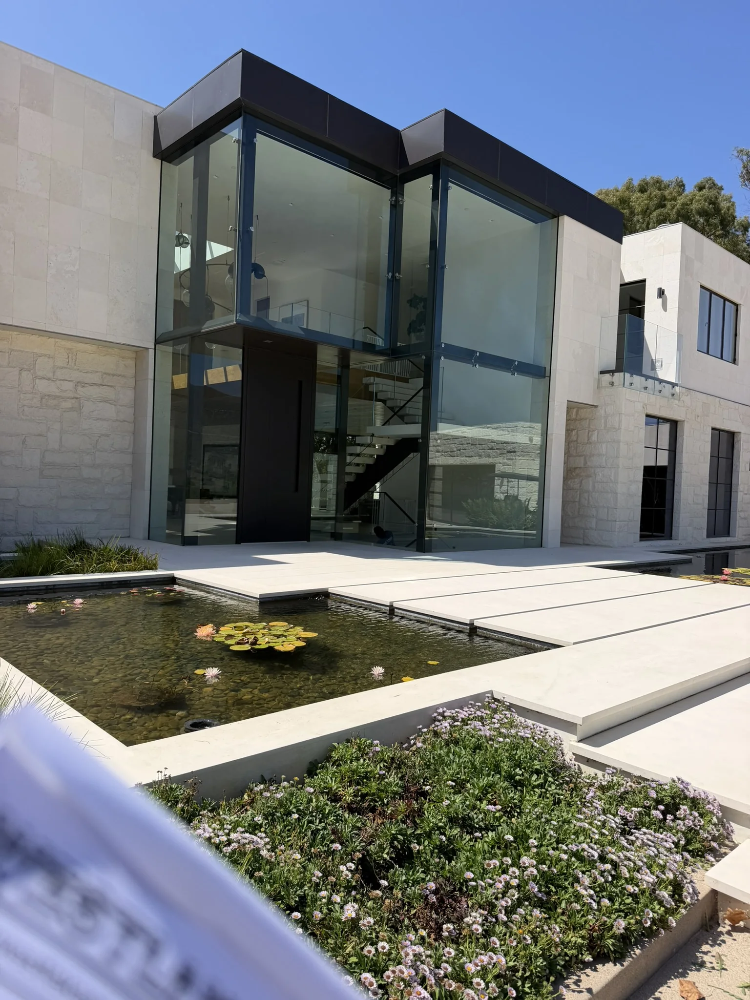 Contemporary residence with a two-story glass facade