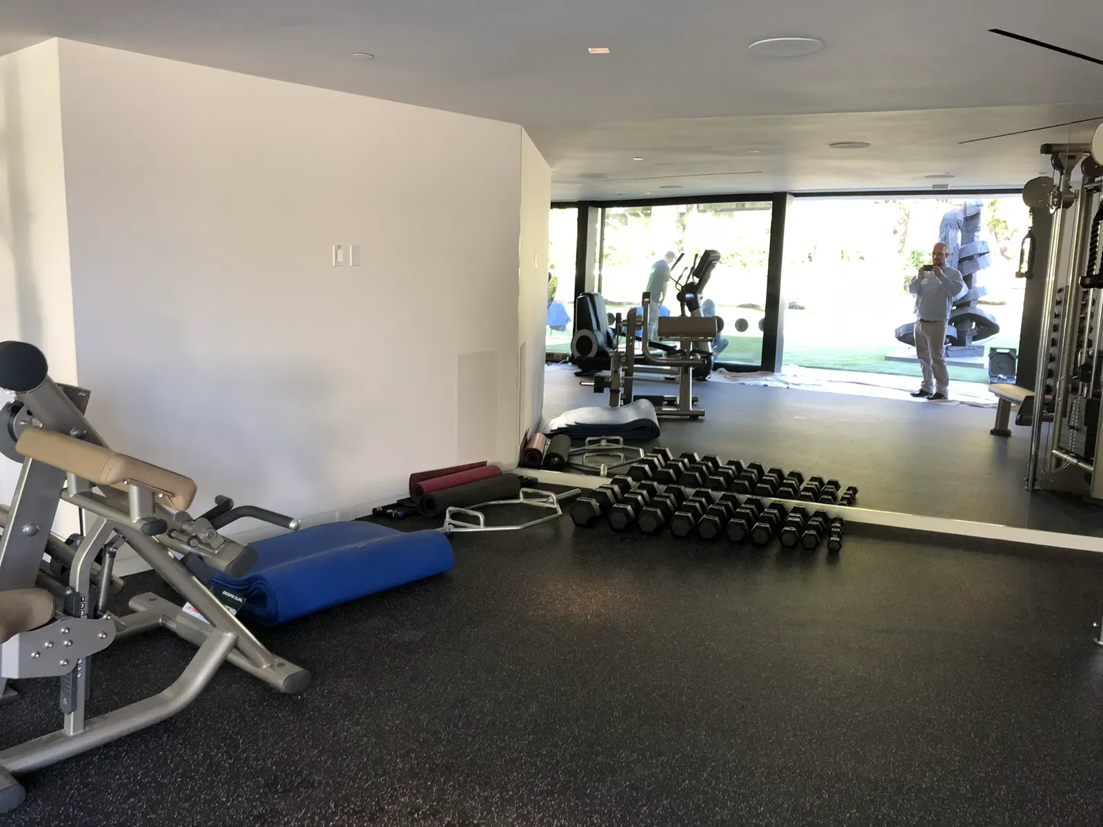 Floor-to-ceiling sliding glass doors in a home gym