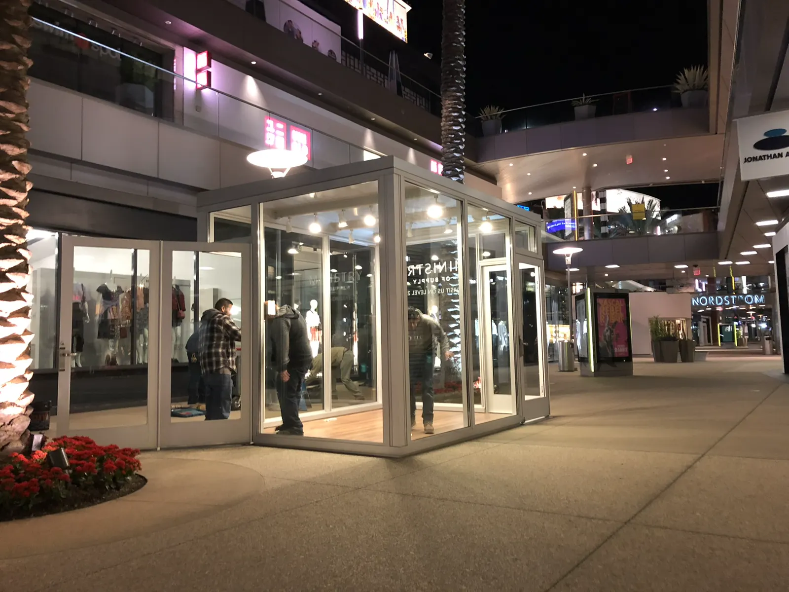 Night view of an illuminated glass storefront