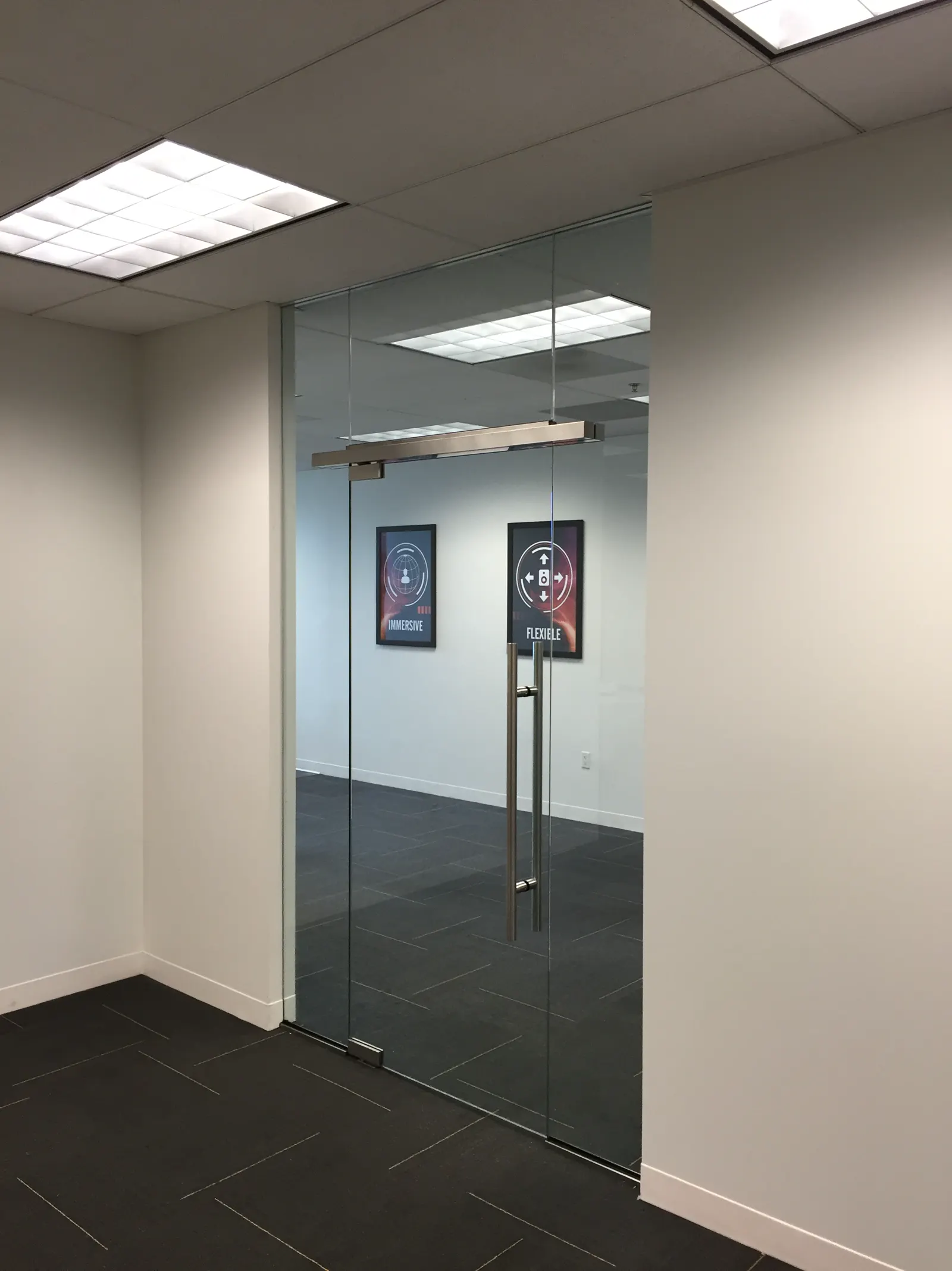 Commercial glass entrance with a floating header