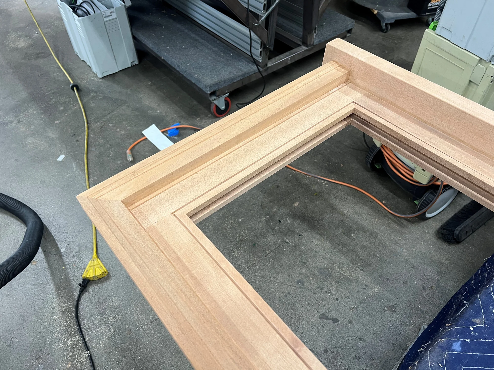 Custom wood window frame being fabricated in the Westlake Glass shop