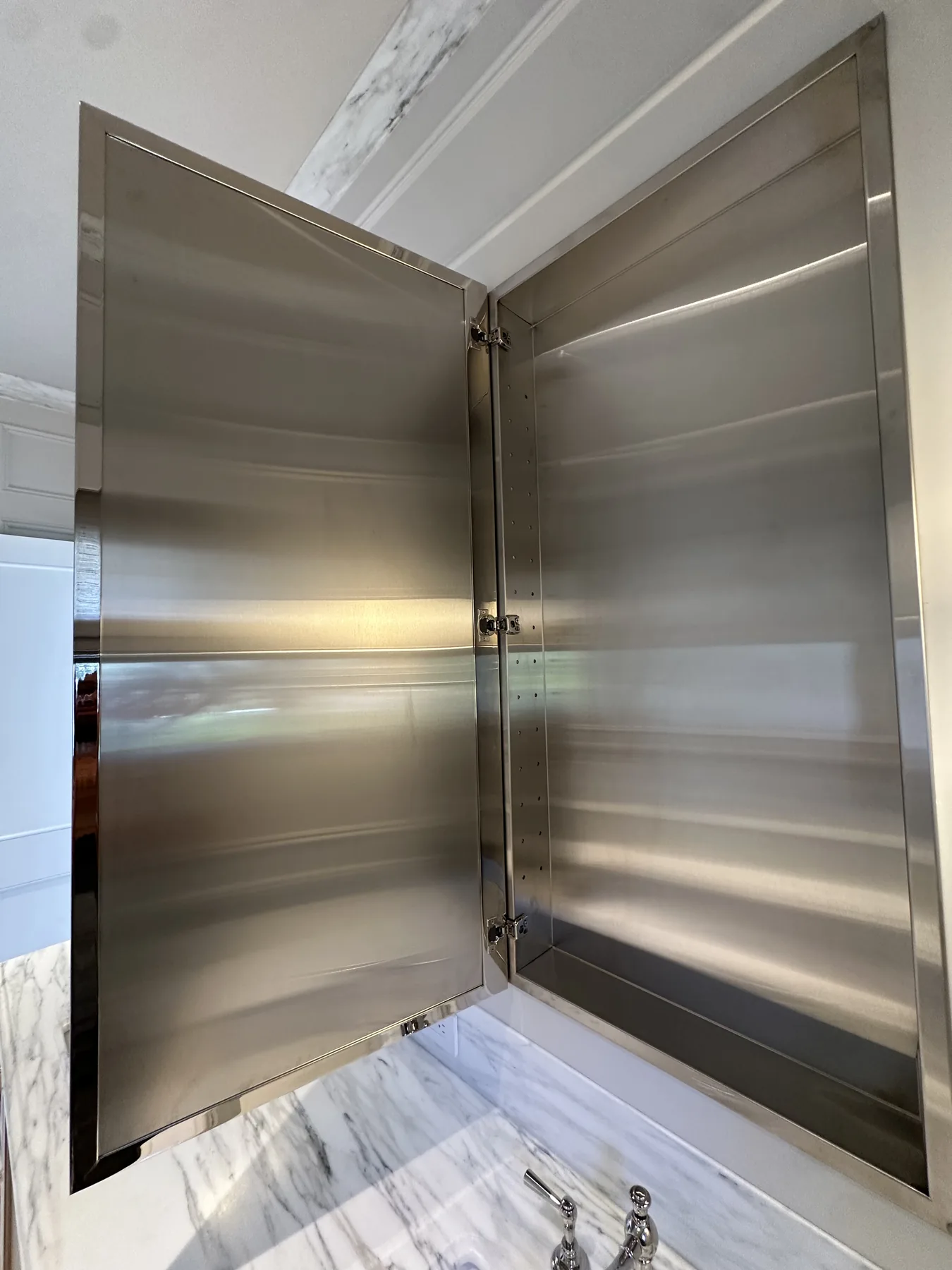 Open stainless steel cabinet with adjustable shelf pins