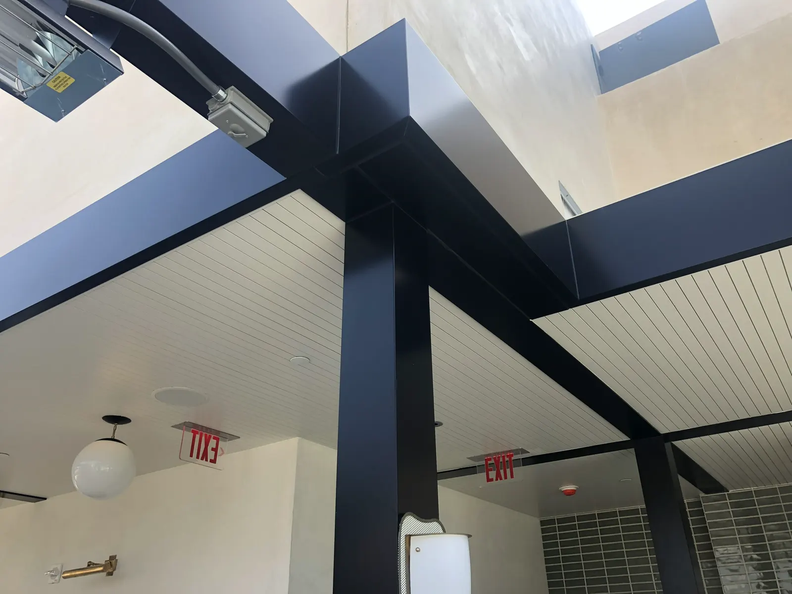 Black metal framing for a glass canopy