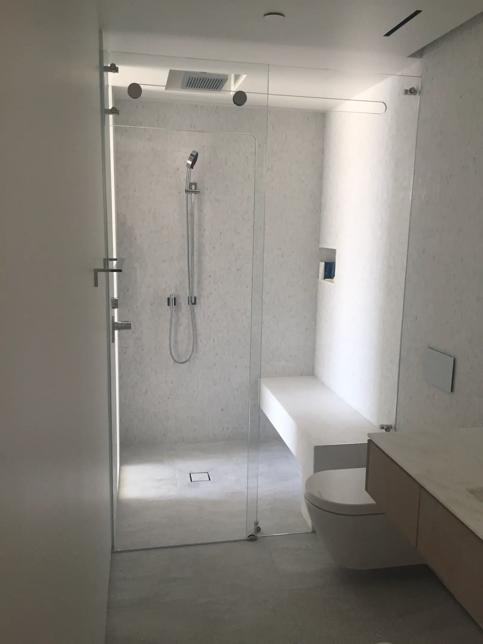 Completed frameless glass shower enclosure seen from above