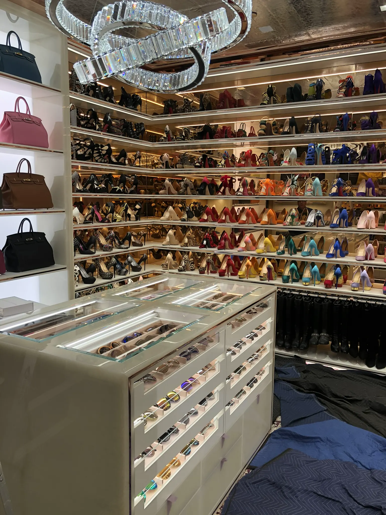 Glass-topped drawers and wall glass shelving in a closet