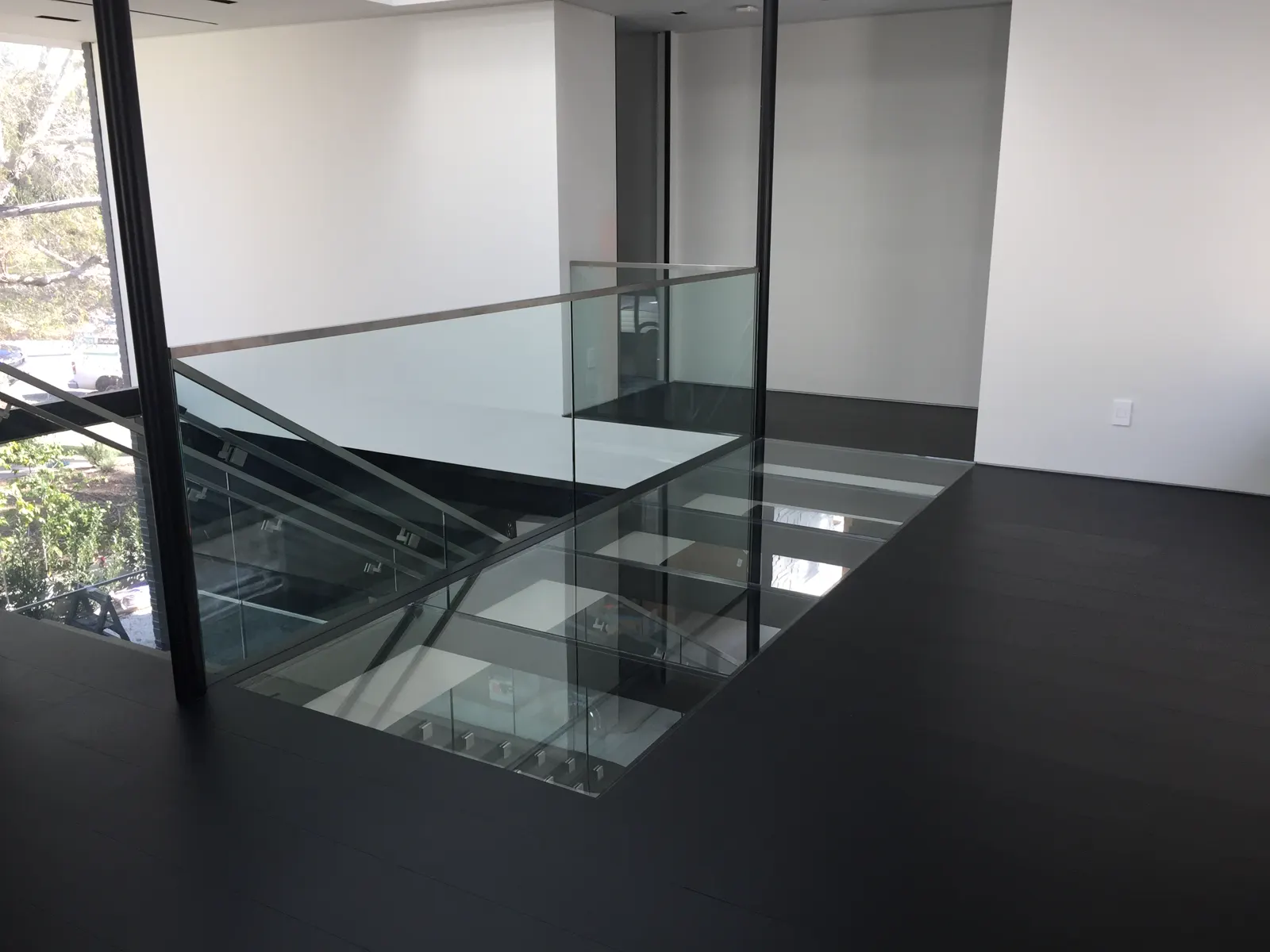 Glass floor panels and a minimal glass railing