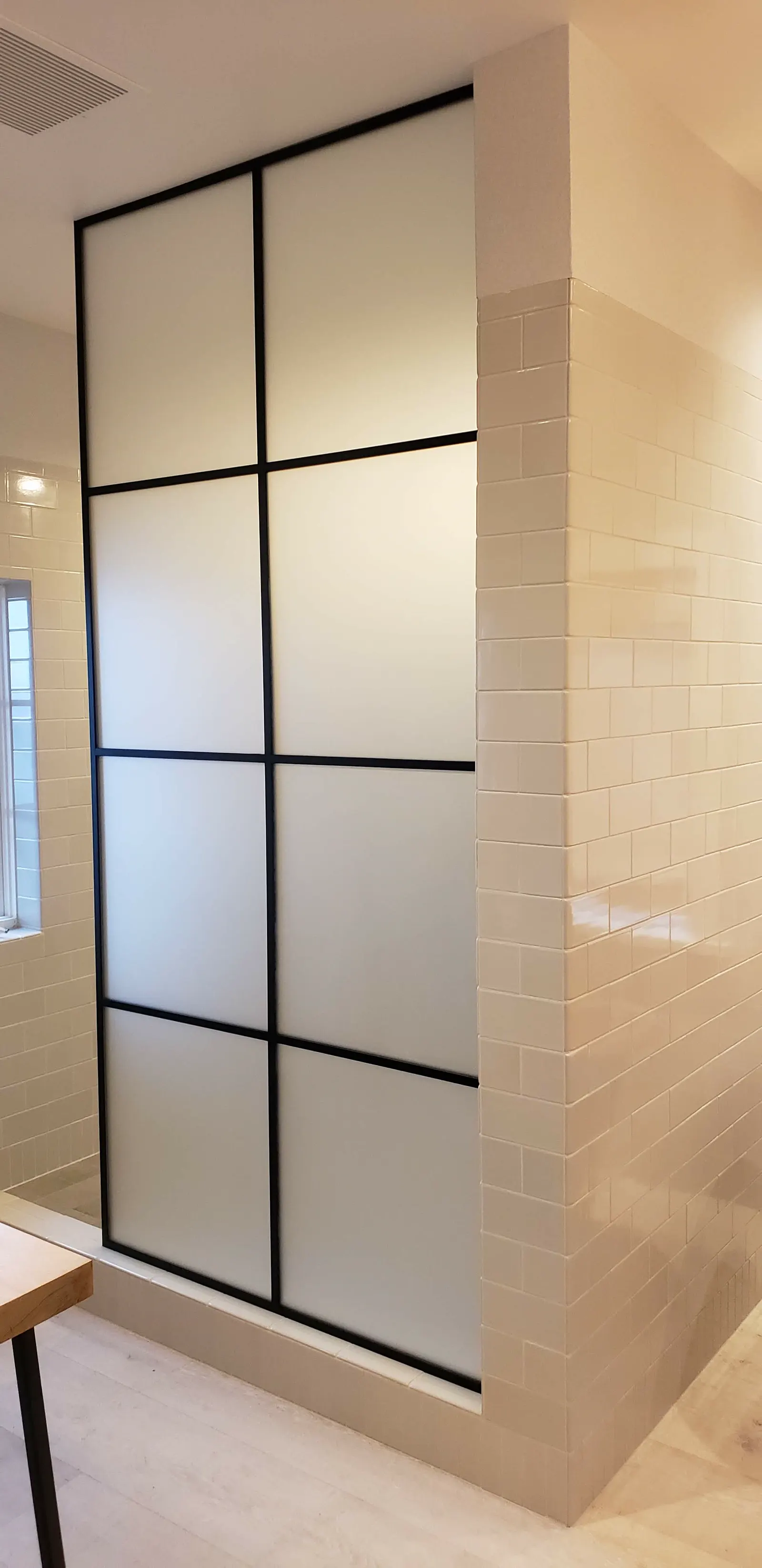 Frosted glass grid partition in a black frame
